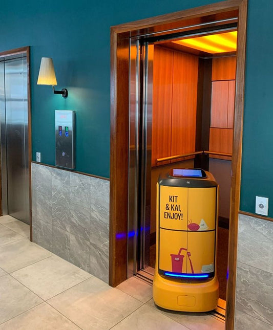 Service robot welcoming guests in an Indian hotel lobby